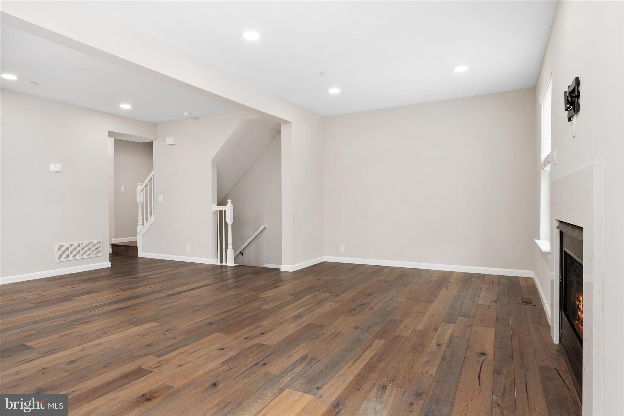 1711 Glebe Creek Way Odenton, MD 21113 - Photo 14 of 33 a view of an empty room with wooden floor and a window
