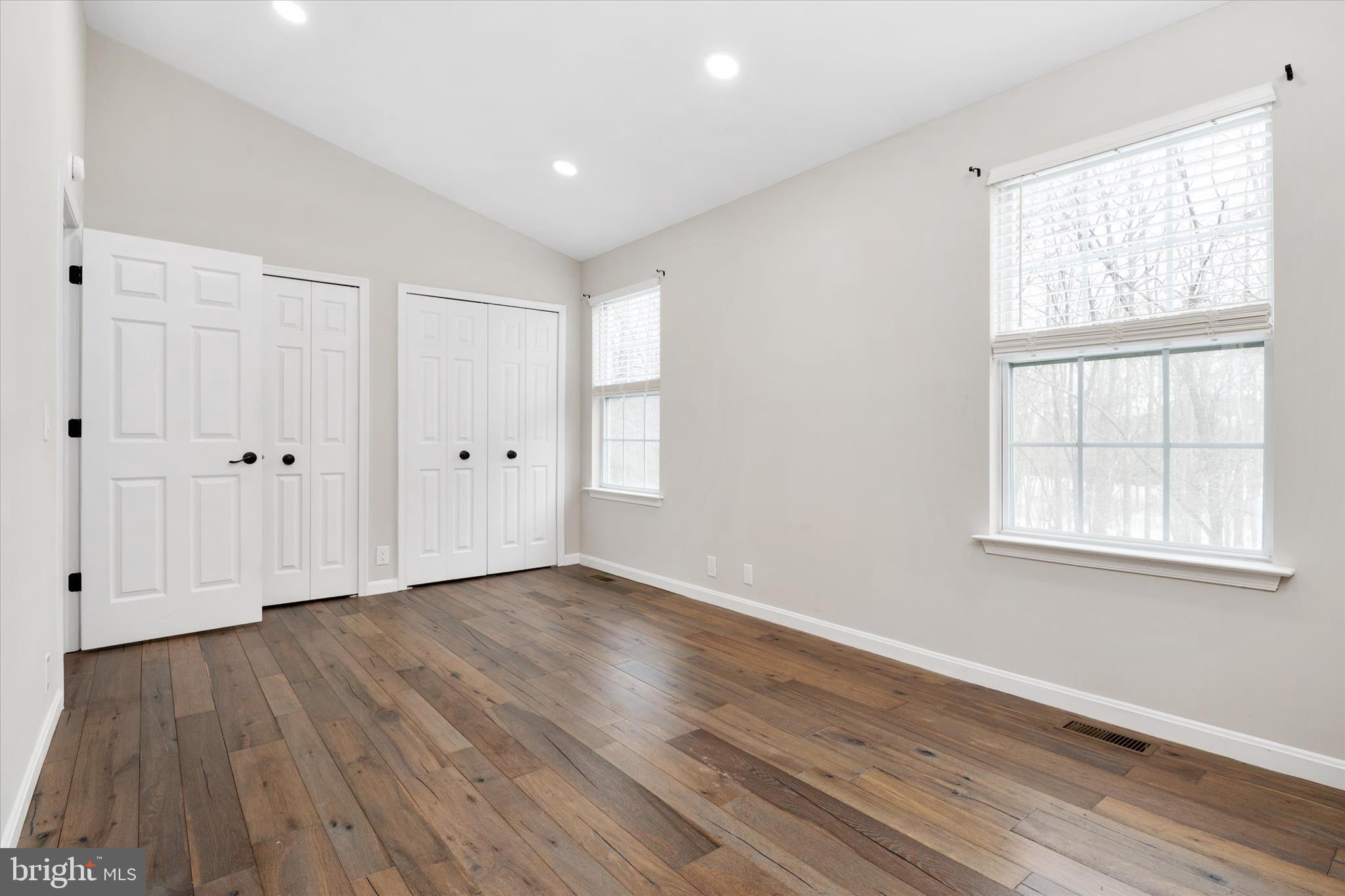 1711 Glebe Creek Way Odenton, MD 21113 - Photo 18 of 33 an empty room with wooden floor and windows