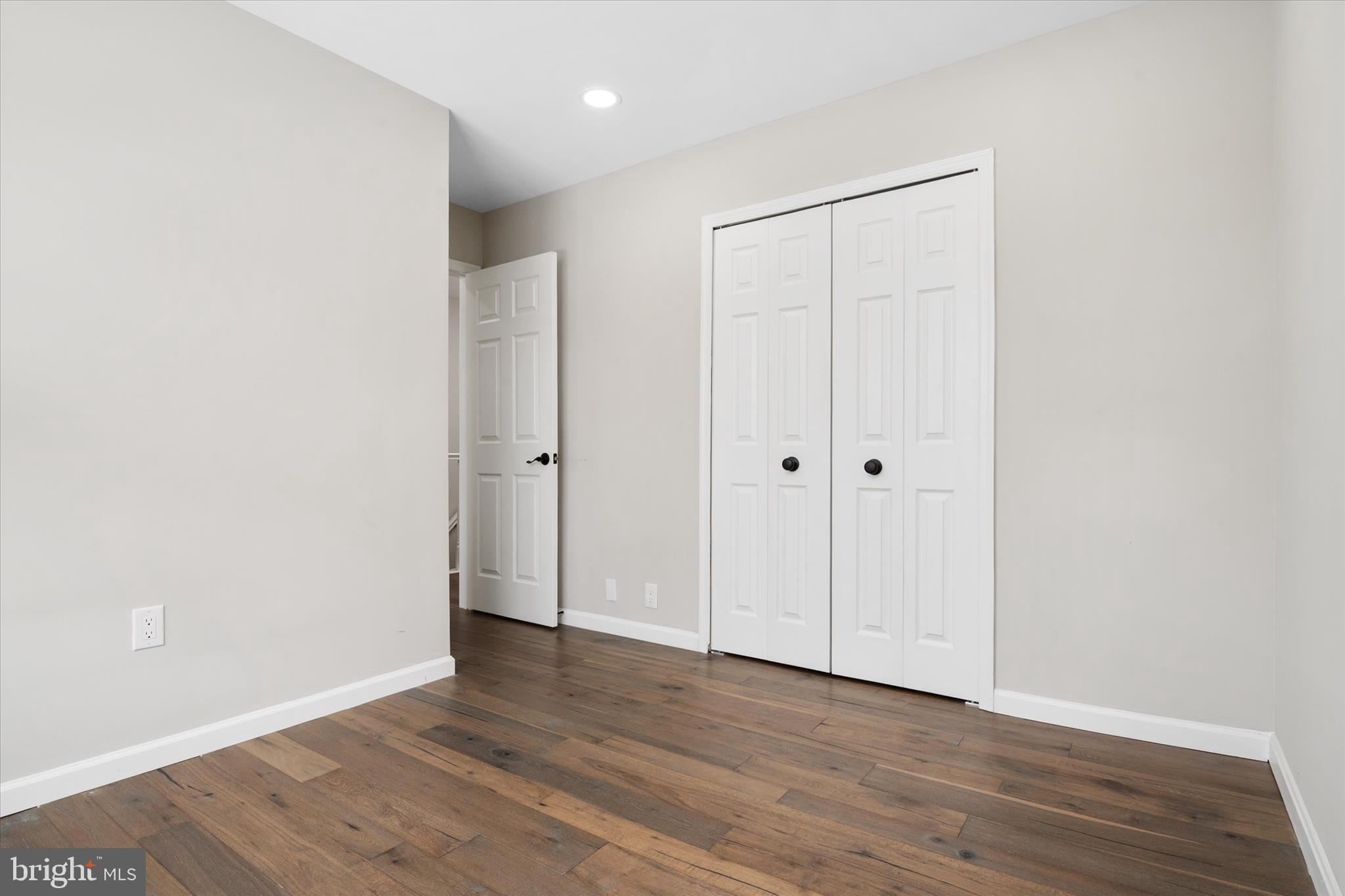 1711 Glebe Creek Way Odenton, MD 21113 - Photo 21 of 33 a view of an empty room with wooden floor