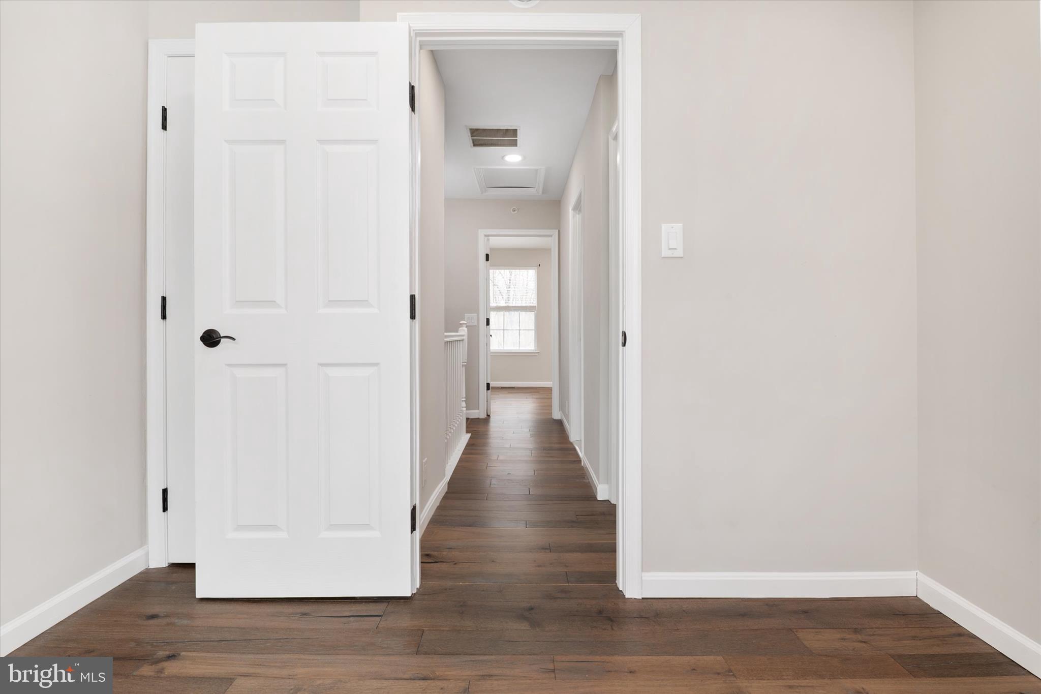 1711 Glebe Creek Way Odenton, MD 21113 - Photo 23 of 33 a view of a hallway with wooden floor
