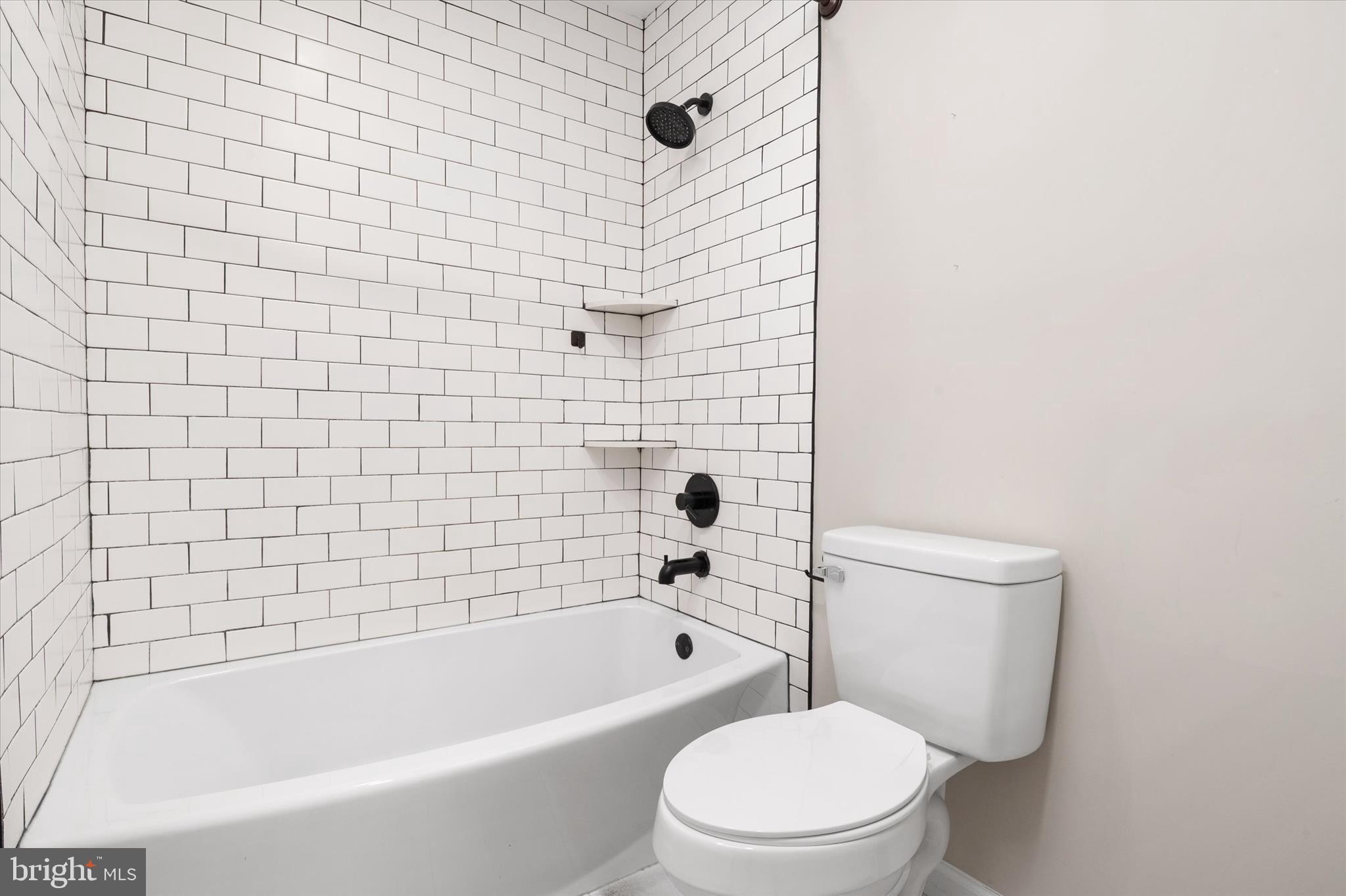 1711 Glebe Creek Way Odenton, MD 21113 - Photo 25 of 33 a white bath tub sitting next to a white toilet