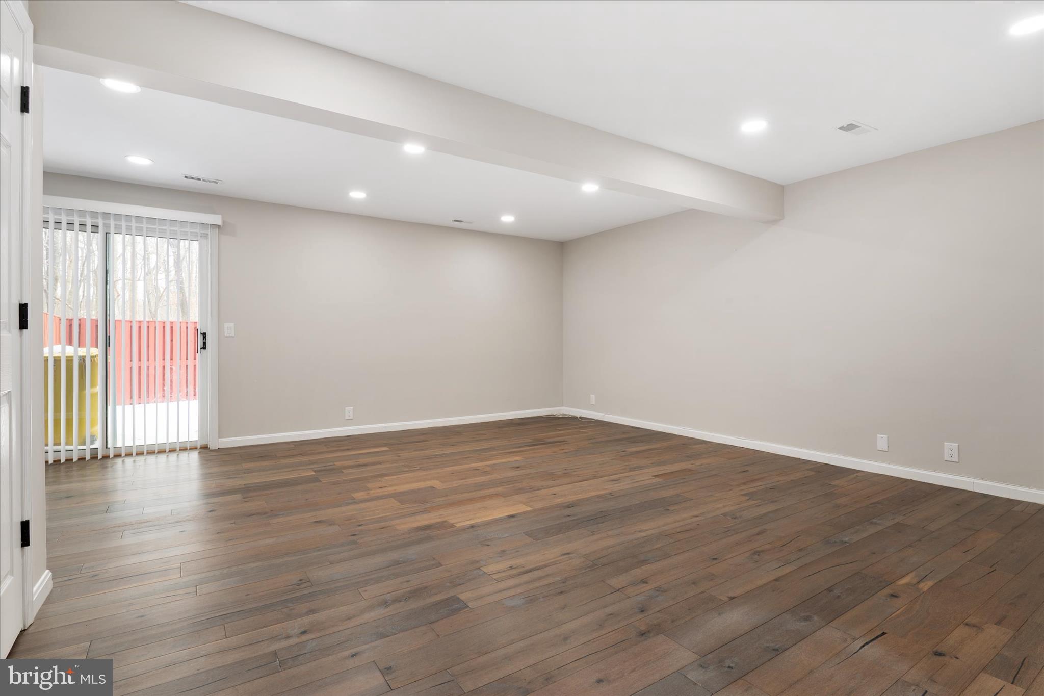 1711 Glebe Creek Way Odenton, MD 21113 - Photo 26 of 33 a view of an empty room with wooden floor