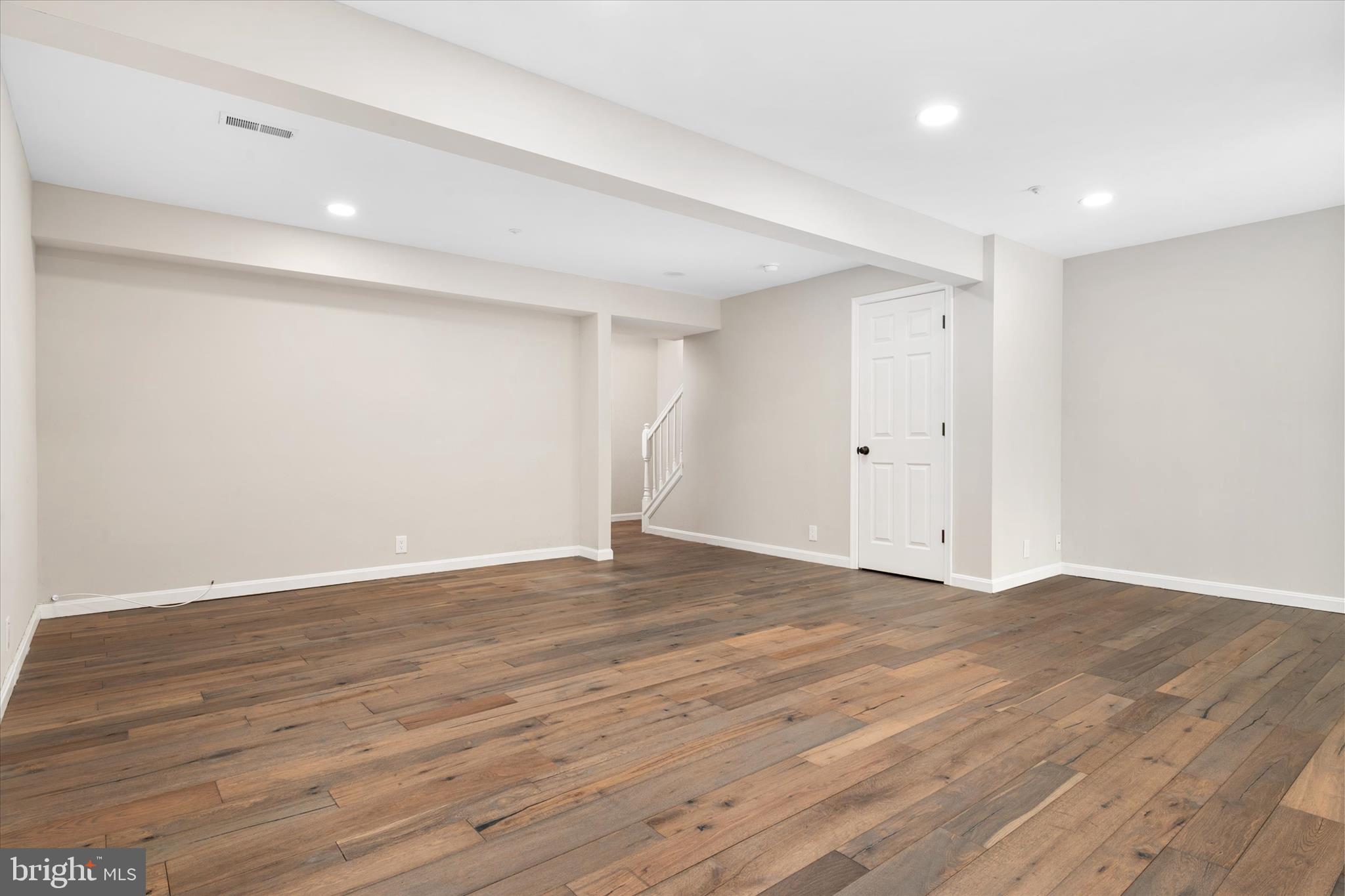 1711 Glebe Creek Way Odenton, MD 21113 - Photo 28 of 33 a view of an empty room with wooden floor