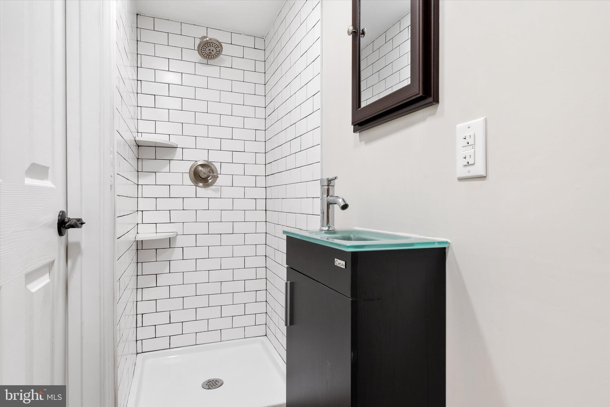 1711 Glebe Creek Way Odenton, MD 21113 - Photo 29 of 33 a bathroom with a sink and mirror