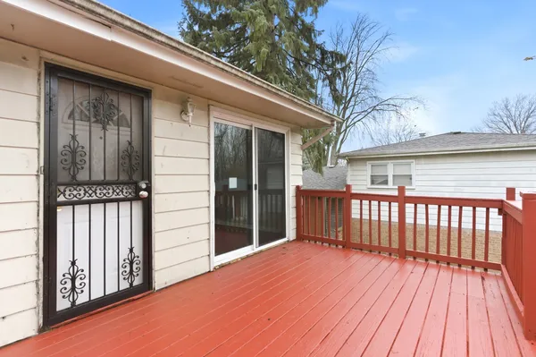 a view of backyard with a deck