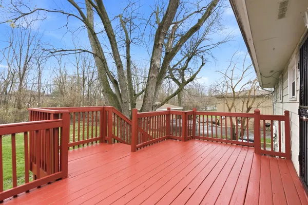 a view of deck with wooden floor and fence
