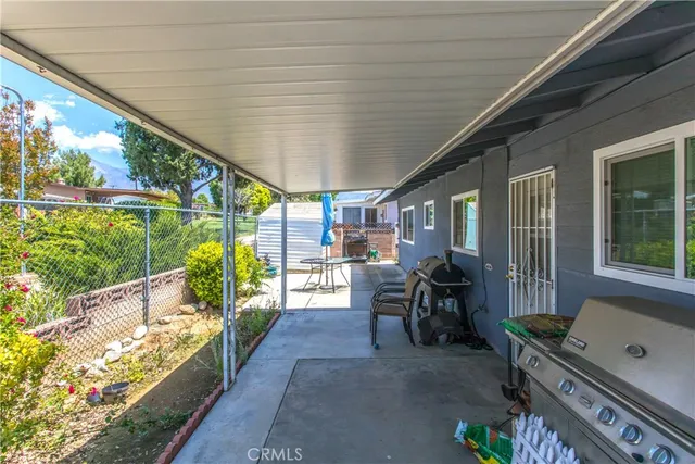 a dining room with furniture and a garden