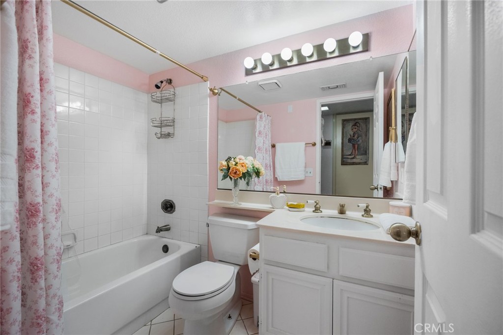 6990 Stanislaus Place Rancho Cucamonga, CA 91701 - Photo 11 of 25 a bathroom with a sink a toilet and shower