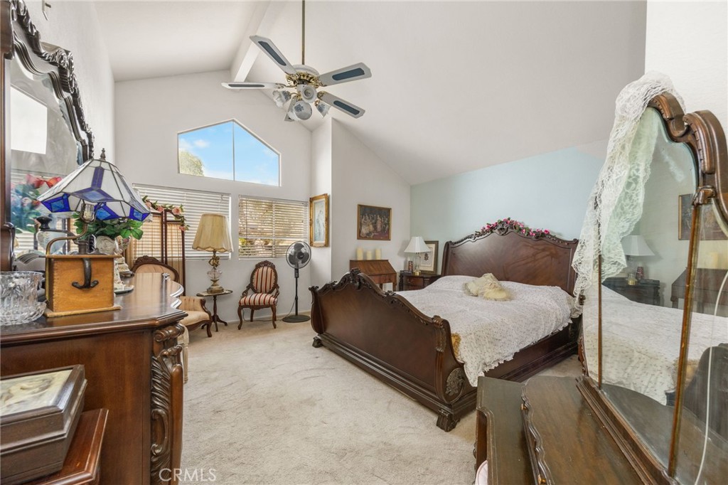 6990 Stanislaus Place Rancho Cucamonga, CA 91701 - Photo 13 of 25 a bedroom with furniture and a chandelier