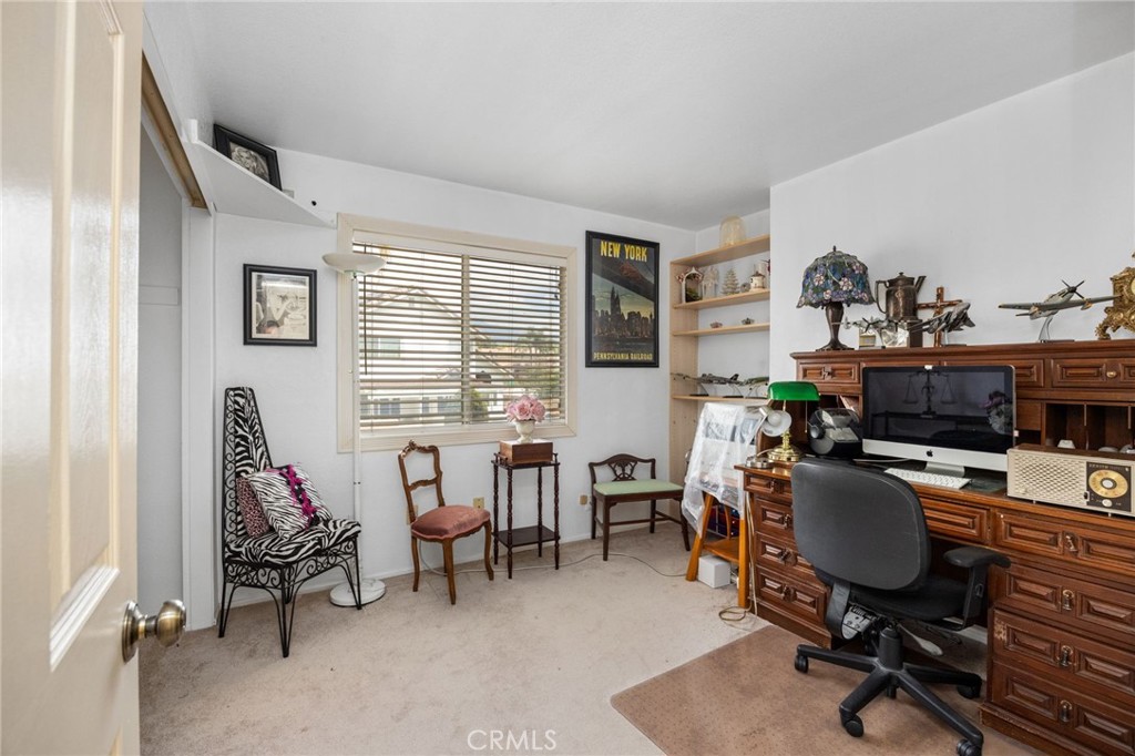 6990 Stanislaus Place Rancho Cucamonga, CA 91701 - Photo 16 of 25 a view of a livingroom with workspace and a window