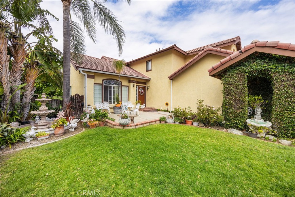 6990 Stanislaus Place Rancho Cucamonga, CA 91701 - Photo 3 of 25 a view of a house with backyard porch and sitting area