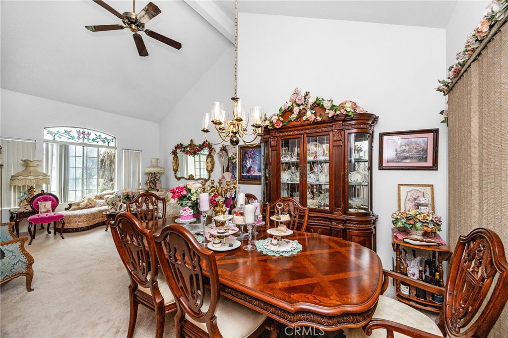 6990 Stanislaus Place Rancho Cucamonga, CA 91701 - Photo 5 of 25 a view of a dining room with furniture and chandelier