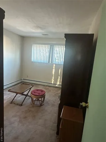 a room with pool table and window