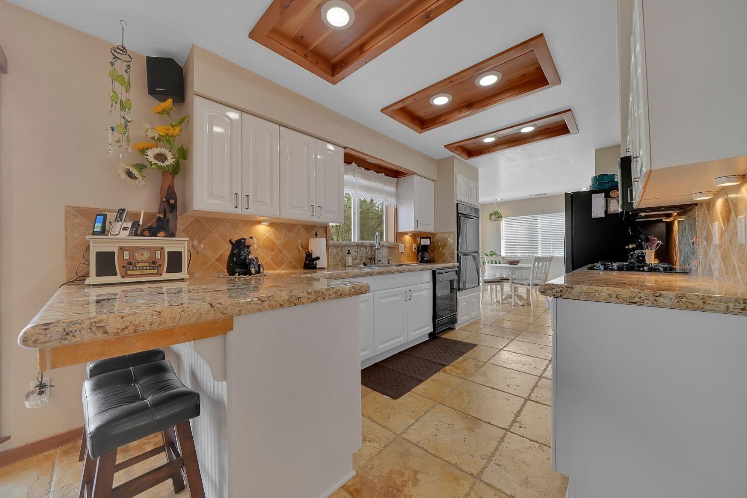 301 Bald Mountain Road West Point, CA 95255 - Photo 13 of 55 a large kitchen with granite countertop a large counter top appliances and cabinets