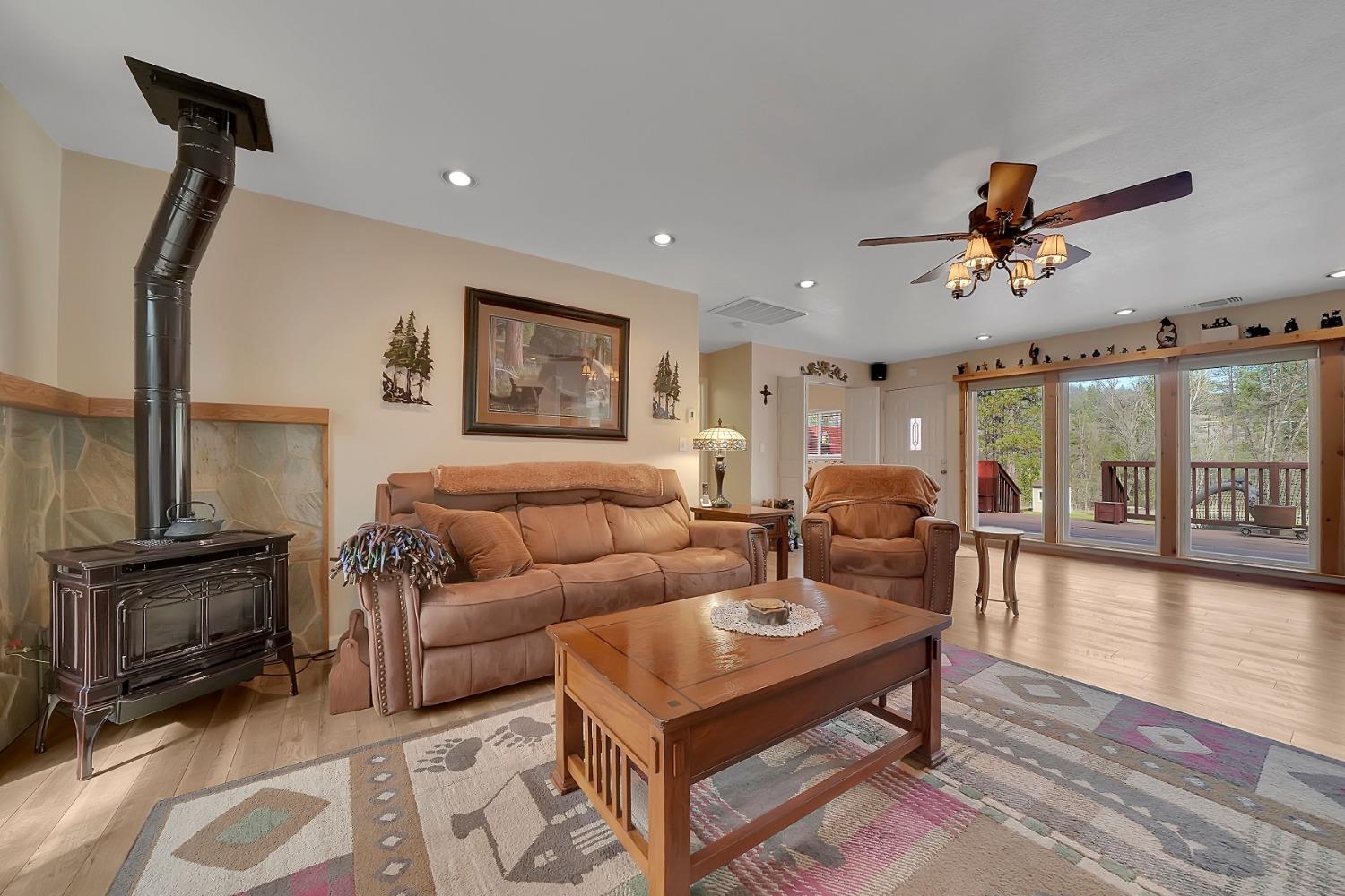 301 Bald Mountain Road West Point, CA 95255 - Photo 19 of 55 a living room with furniture a ceiling fan and a rug