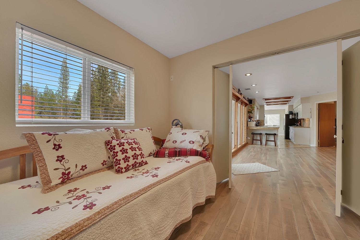 301 Bald Mountain Road West Point, CA 95255 - Photo 25 of 55 a bedroom with a bed and wooden floor