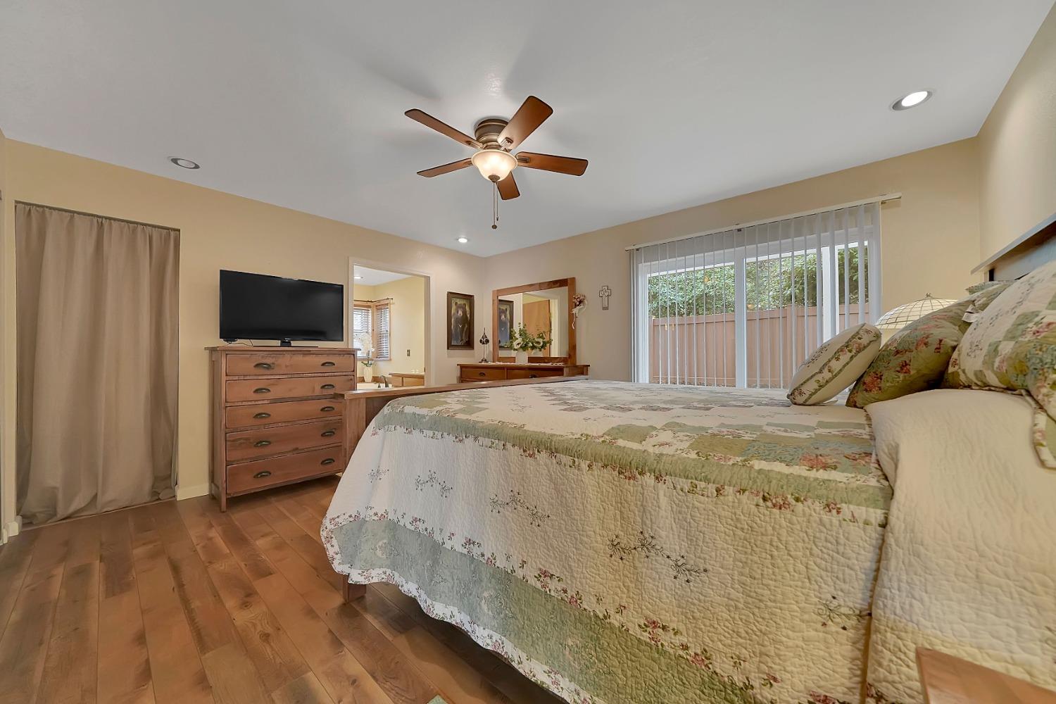 301 Bald Mountain Road West Point, CA 95255 - Photo 29 of 55 a spacious bedroom with a bed and a flat screen tv