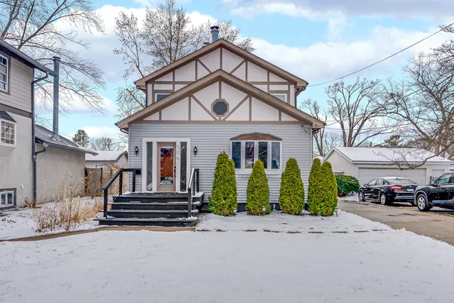 a front view of a house with garden