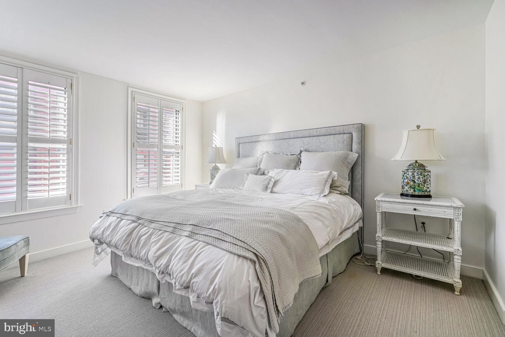 616 E Street Northwest, Unit 1150 Washington, DC 20004 - Photo 27 of 75 a bedroom with a bed and windows