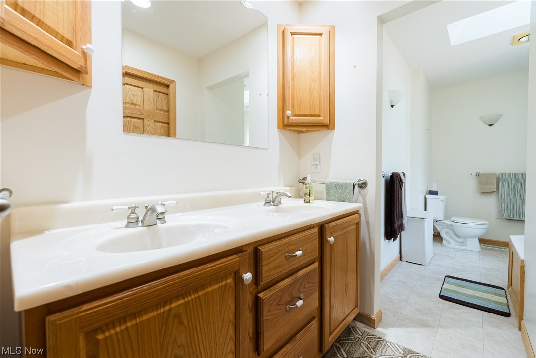 7055 Clark Road Atwater, OH 44201 - Photo 9 of 34 Primary bathroom with double sink.