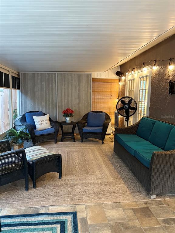 802 Woodhill Court Palm Harbor, FL 34683 - Photo 16 of 20 a living room with furniture and a lamp