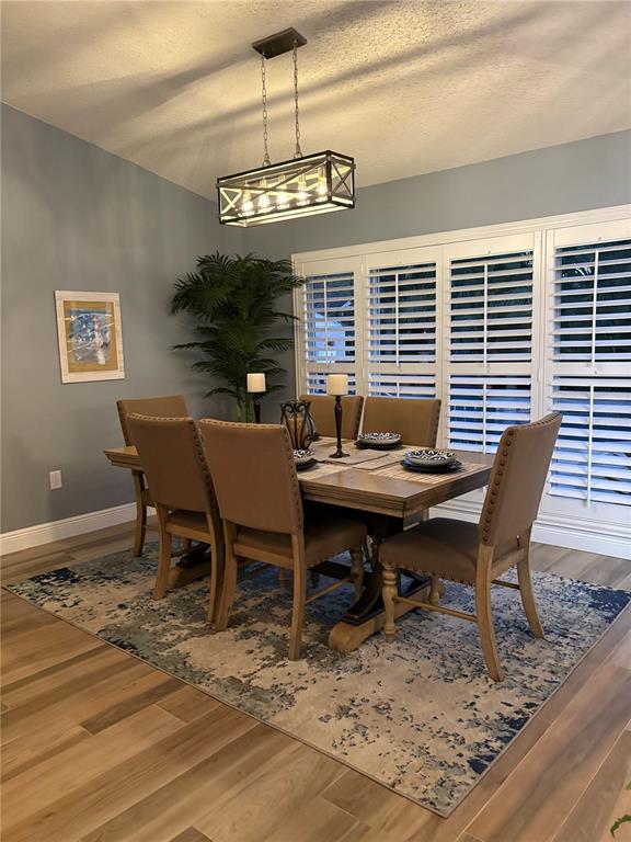 802 Woodhill Court Palm Harbor, FL 34683 - Photo 6 of 20 a view of a dining room with furniture