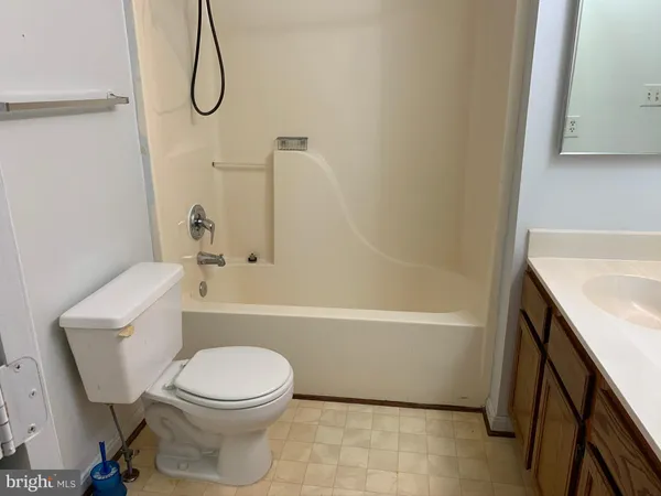 a bathroom with a sink a toilet and a bathtub