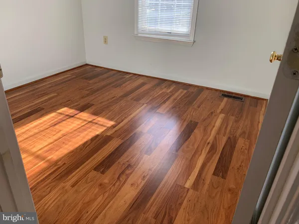 a view of small space with wooden floor