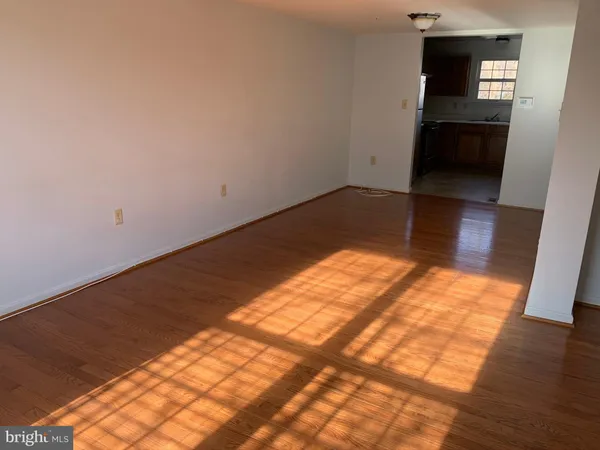 an empty room with wooden floor