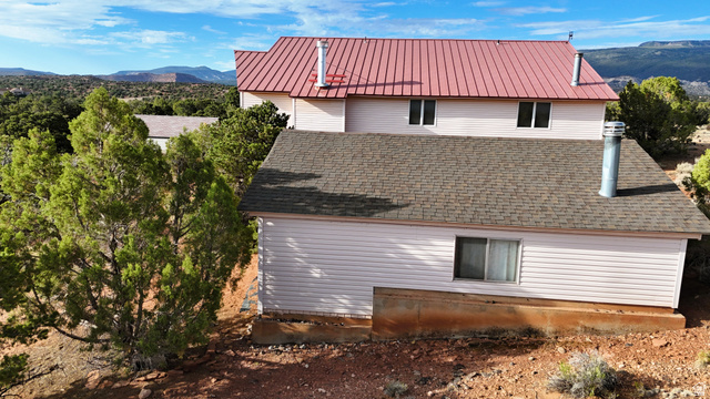 358 South Sky Drive Torrey, UT 84775 - Photo 42 of 82 Multi-level residence featuring a red metal roof and light-colored siding