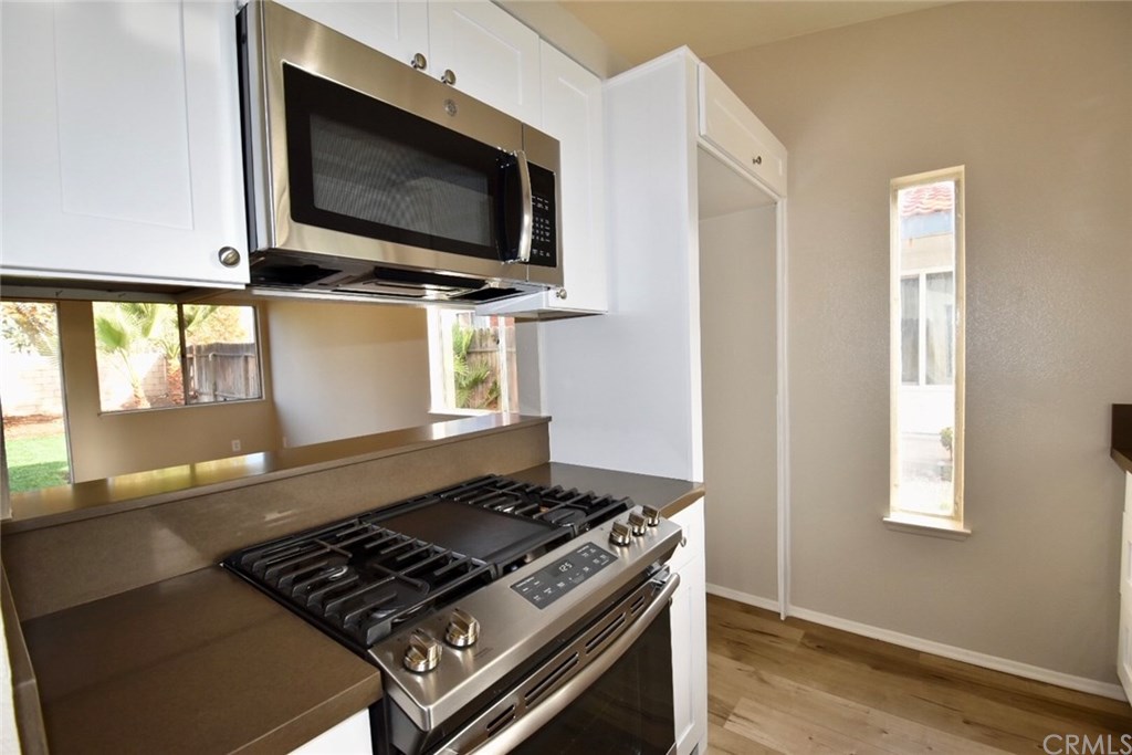 740 Atchison Street Colton, CA 92324 - Photo 4 of 15 a kitchen with a stove and a microwave