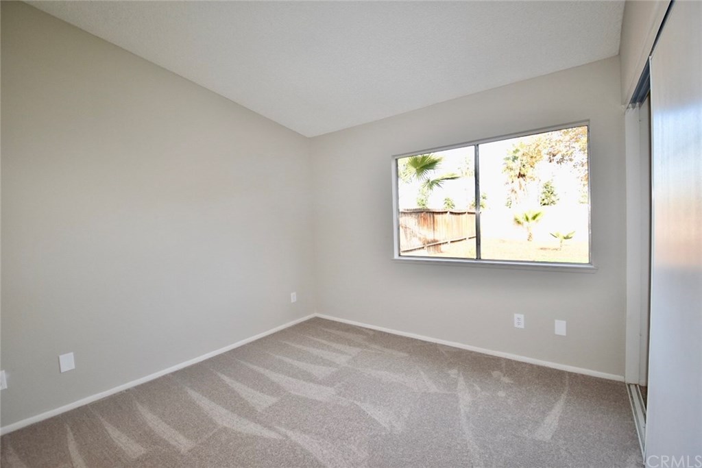740 Atchison Street Colton, CA 92324 - Photo 6 of 15 an empty room with windows