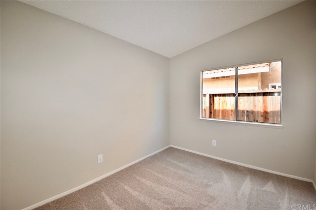 740 Atchison Street Colton, CA 92324 - Photo 8 of 15 an empty room with a window