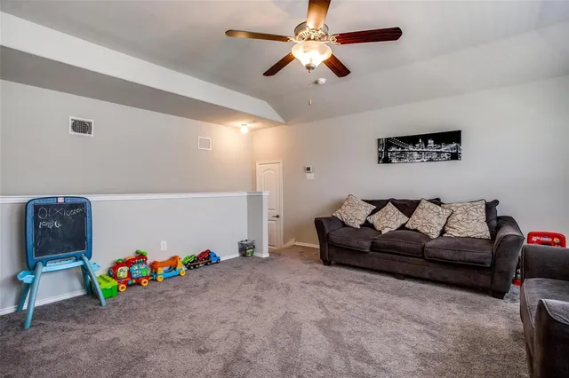 a kitchen with a stove a sink a counter space dining table and chairs