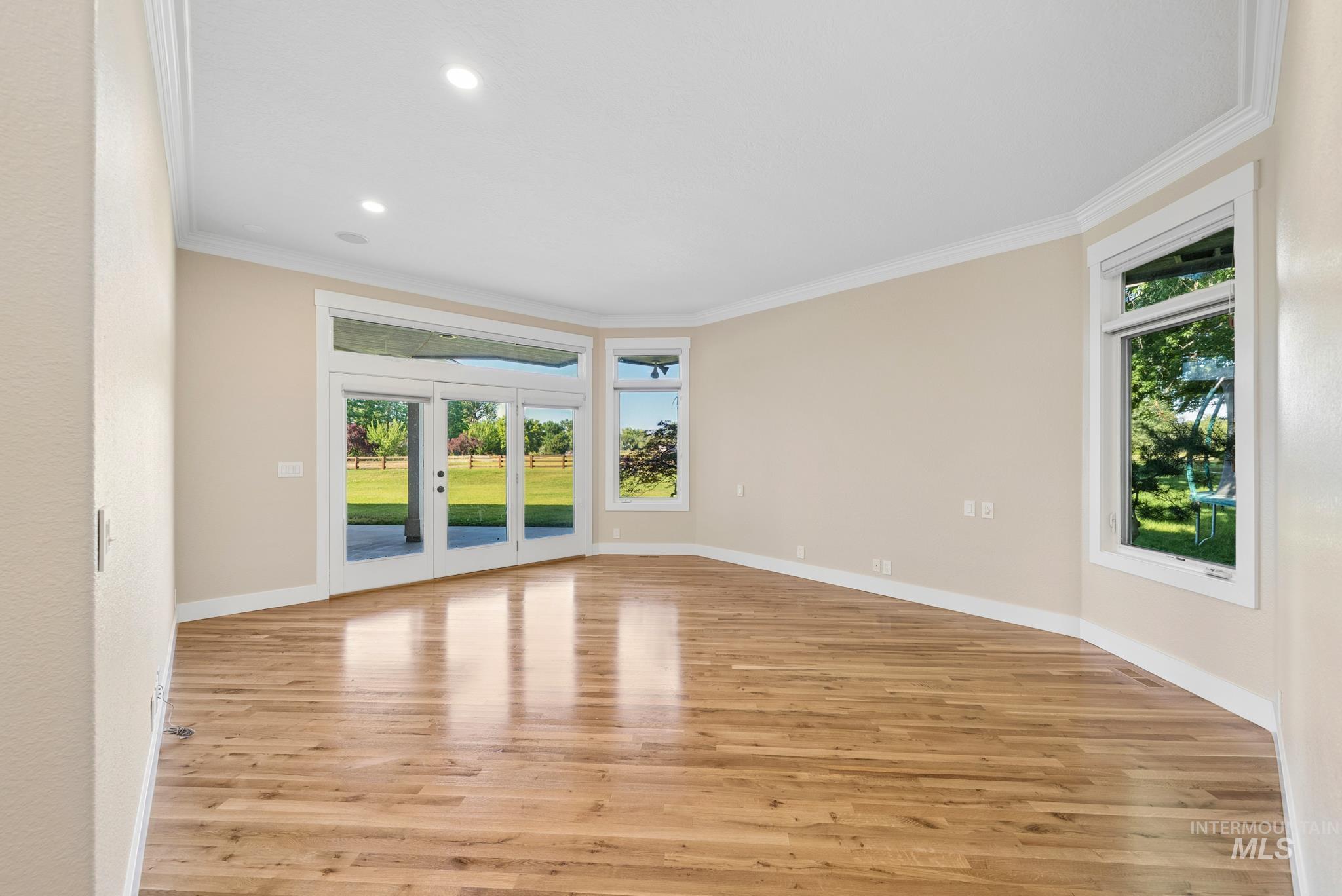 2050 Artesian Road Eagle, ID 83616 - Photo 22 of 49 Interior hallway featuring wood-finish flooring, recessed lighting, and crisp white trim