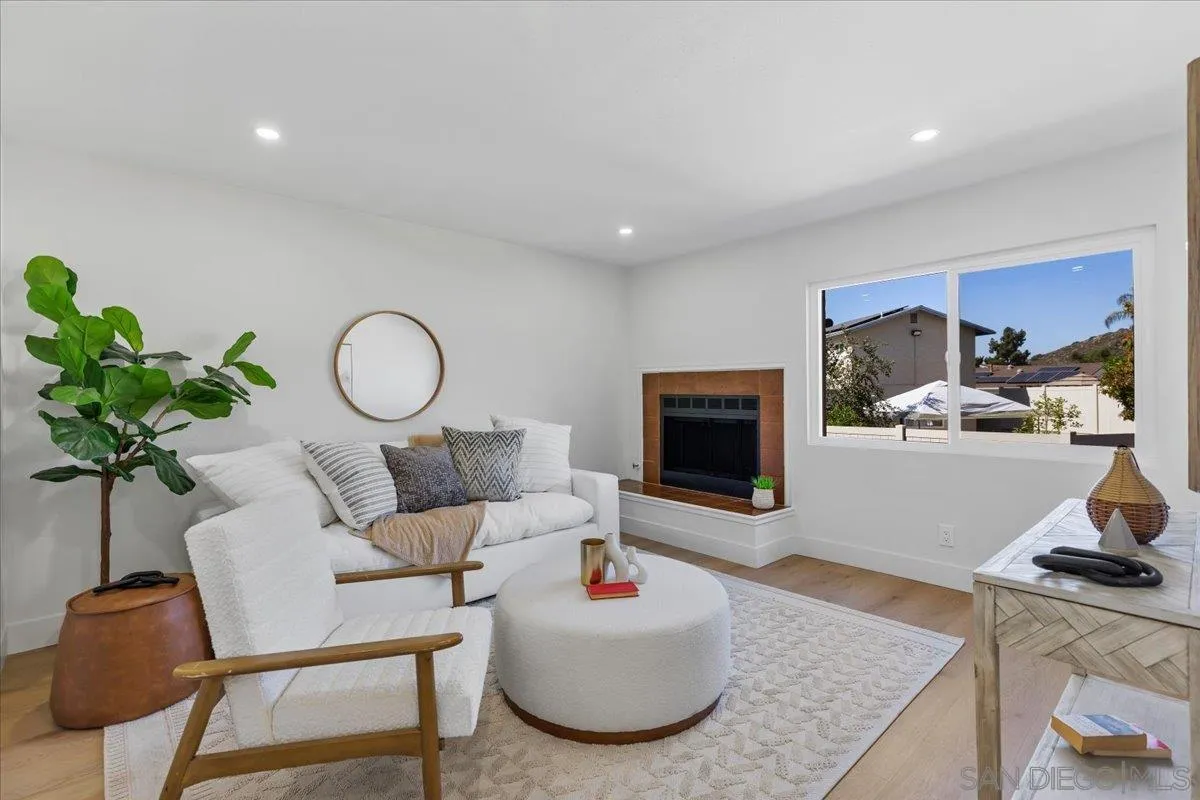 1572 Stone Edge Circle El Cajon, CA 92021 - Photo 1 of 34 a living room with furniture a fireplace and a flat screen tv