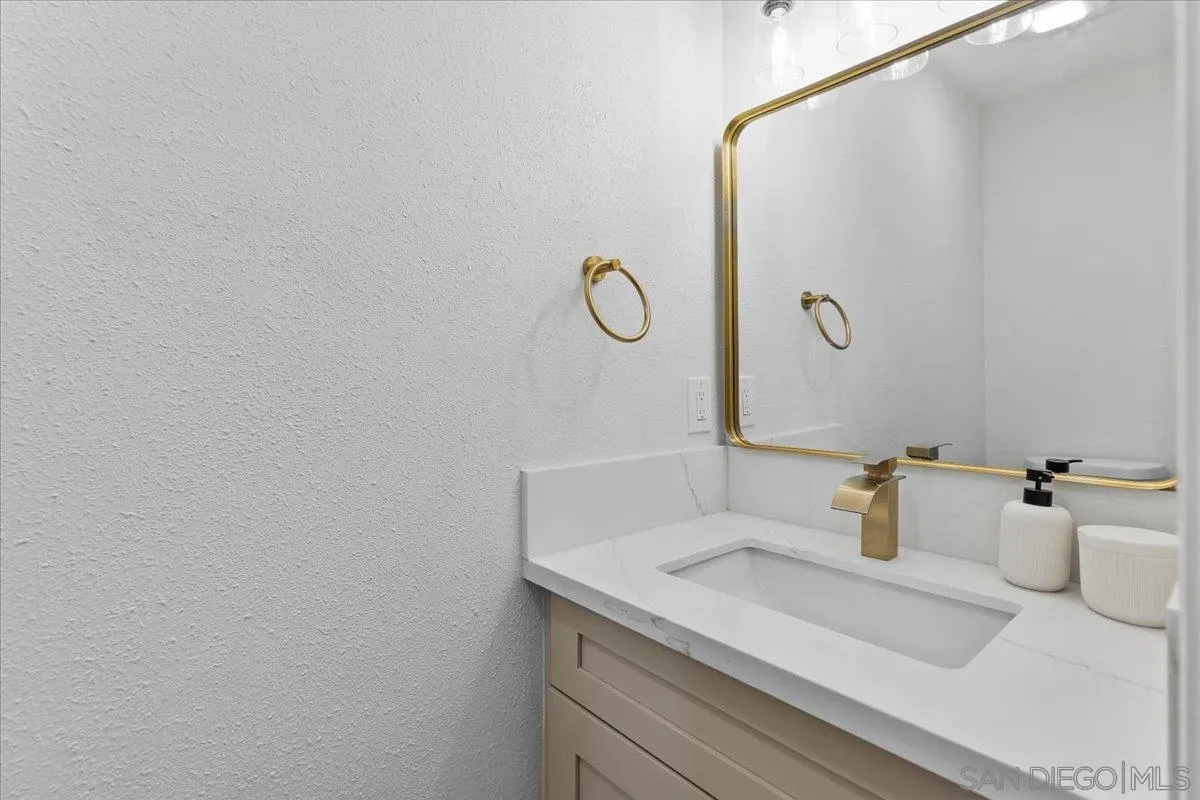 1572 Stone Edge Circle El Cajon, CA 92021 - Photo 15 of 34 a bathroom with a sink and vanity