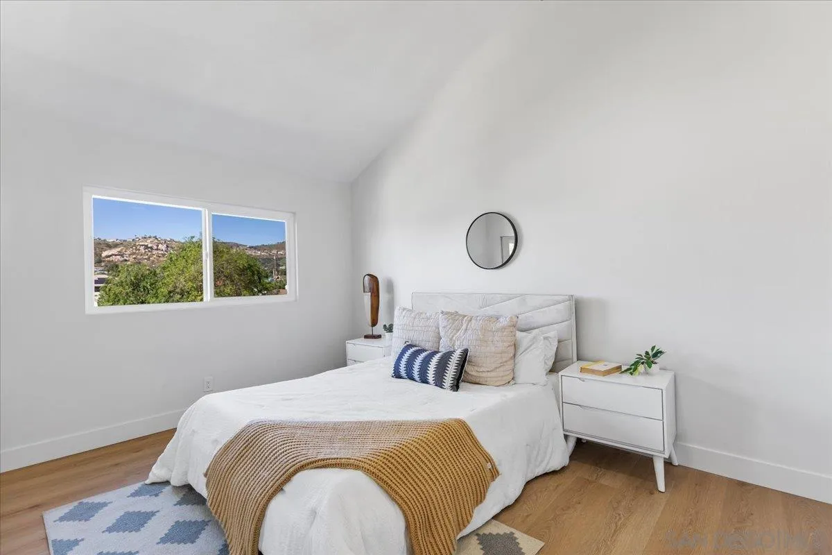1572 Stone Edge Circle El Cajon, CA 92021 - Photo 18 of 34 a bedroom with a bed and a window