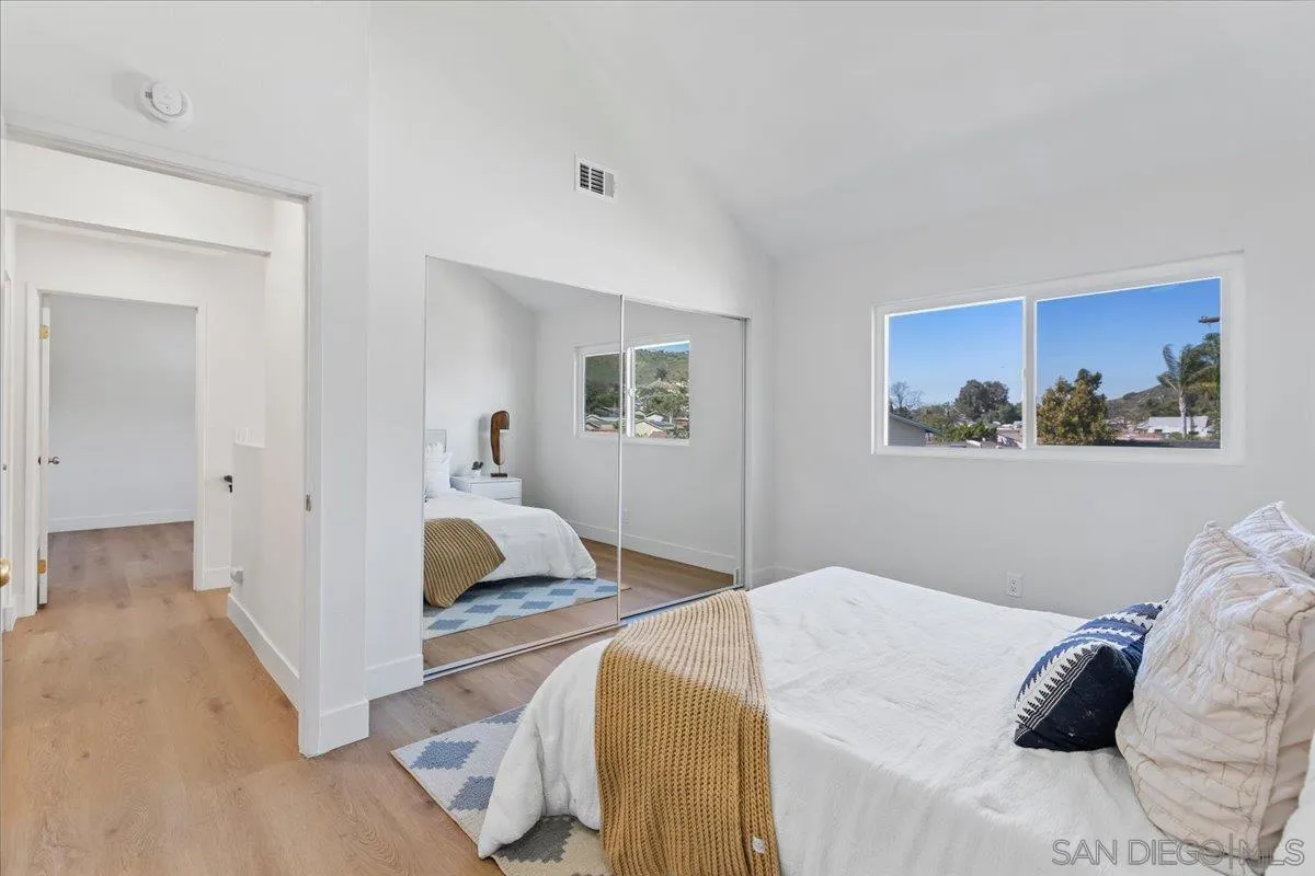 1572 Stone Edge Circle El Cajon, CA 92021 - Photo 21 of 34 a bedroom with a bed and a painting on the wall