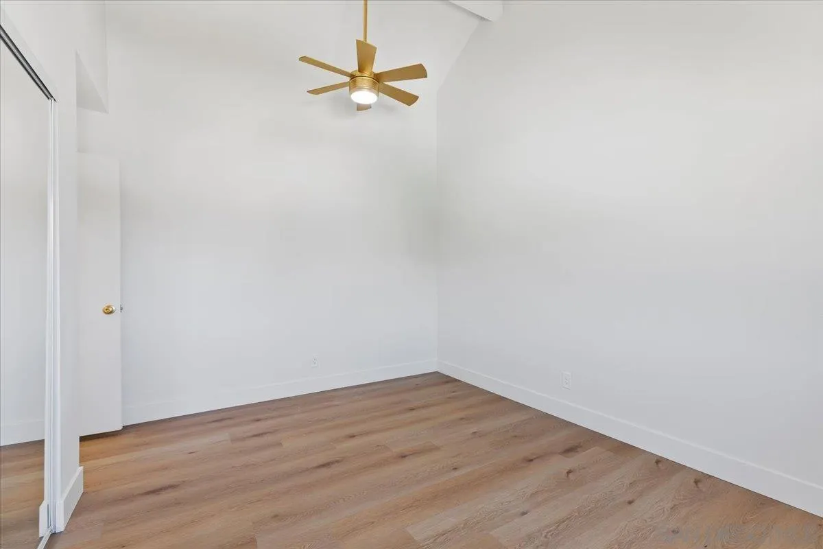 1572 Stone Edge Circle El Cajon, CA 92021 - Photo 25 of 34 a view of a room with wooden floor and white walls
