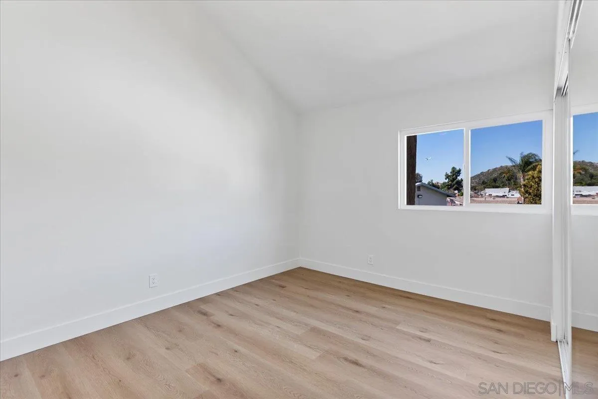 1572 Stone Edge Circle El Cajon, CA 92021 - Photo 26 of 34 a view of a room with wooden floor and closet
