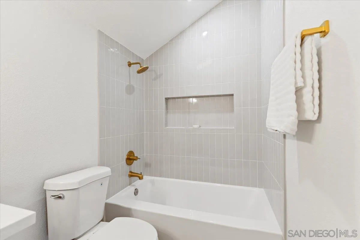 1572 Stone Edge Circle El Cajon, CA 92021 - Photo 28 of 34 a white bath tub sitting next to a white toilet