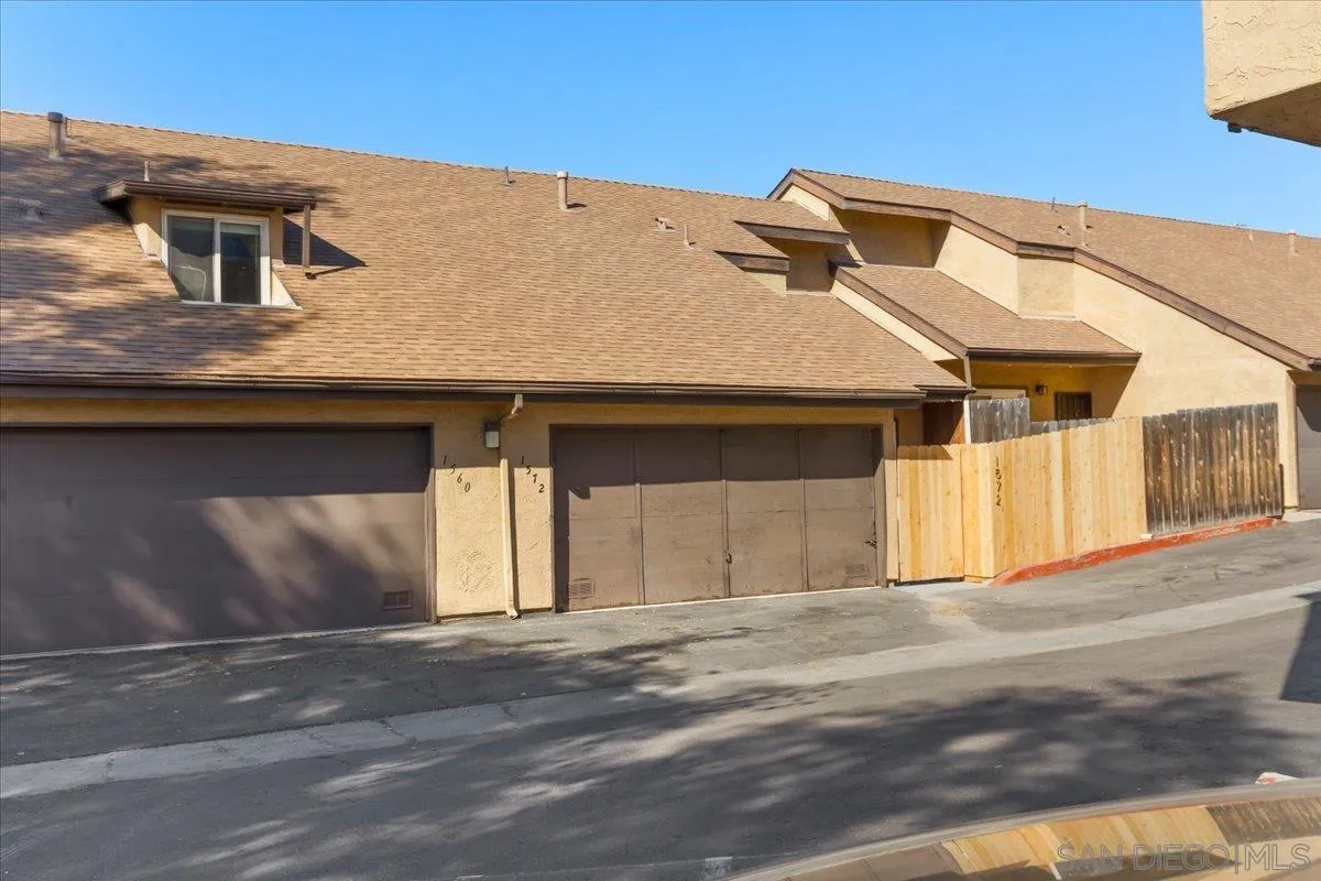 1572 Stone Edge Circle El Cajon, CA 92021 - Photo 3 of 34 a front view of a house with a garage