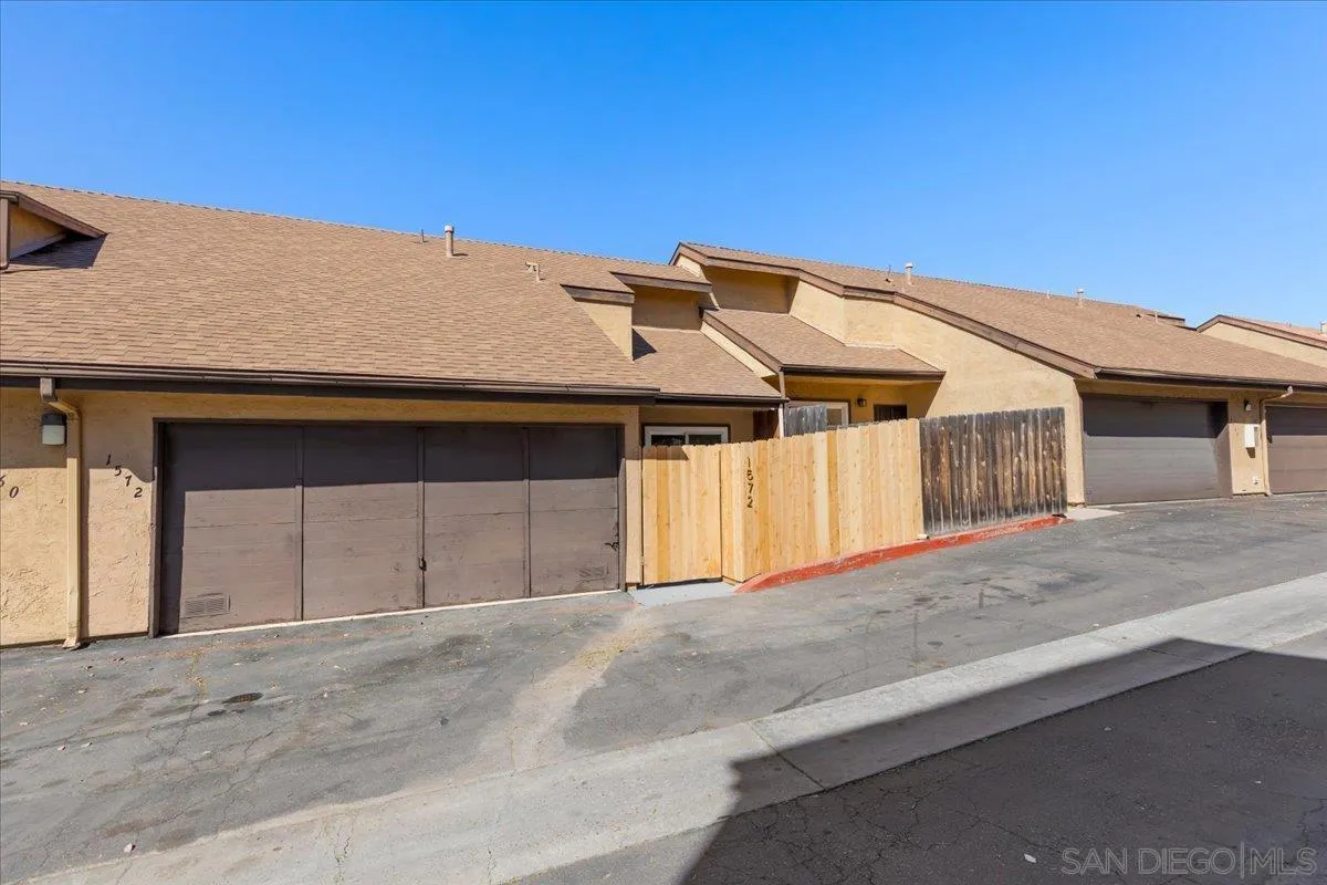 1572 Stone Edge Circle El Cajon, CA 92021 - Photo 34 of 34 a front view of a house with a garage
