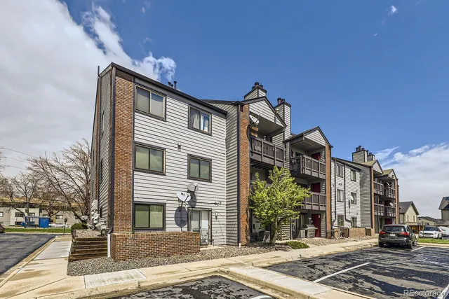 a front view of a house with a street