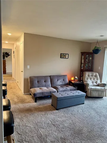 a living room with furniture and a couch
