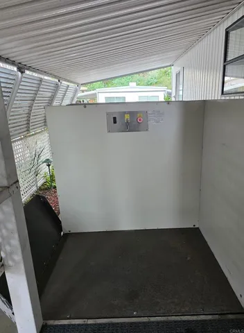 a view of a house with backyard porch and sitting area