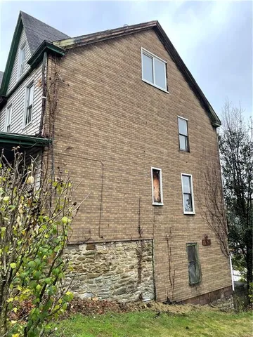 a brick house with a large windows