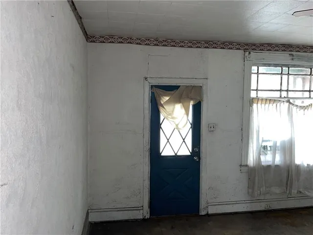 a view of an empty room and window