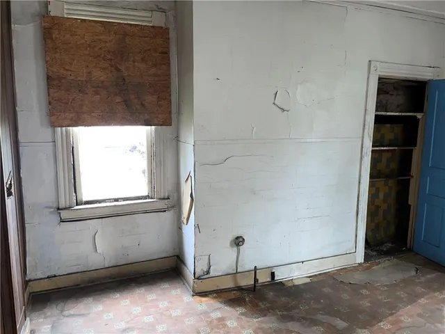 a bathroom with a shower and a toilet